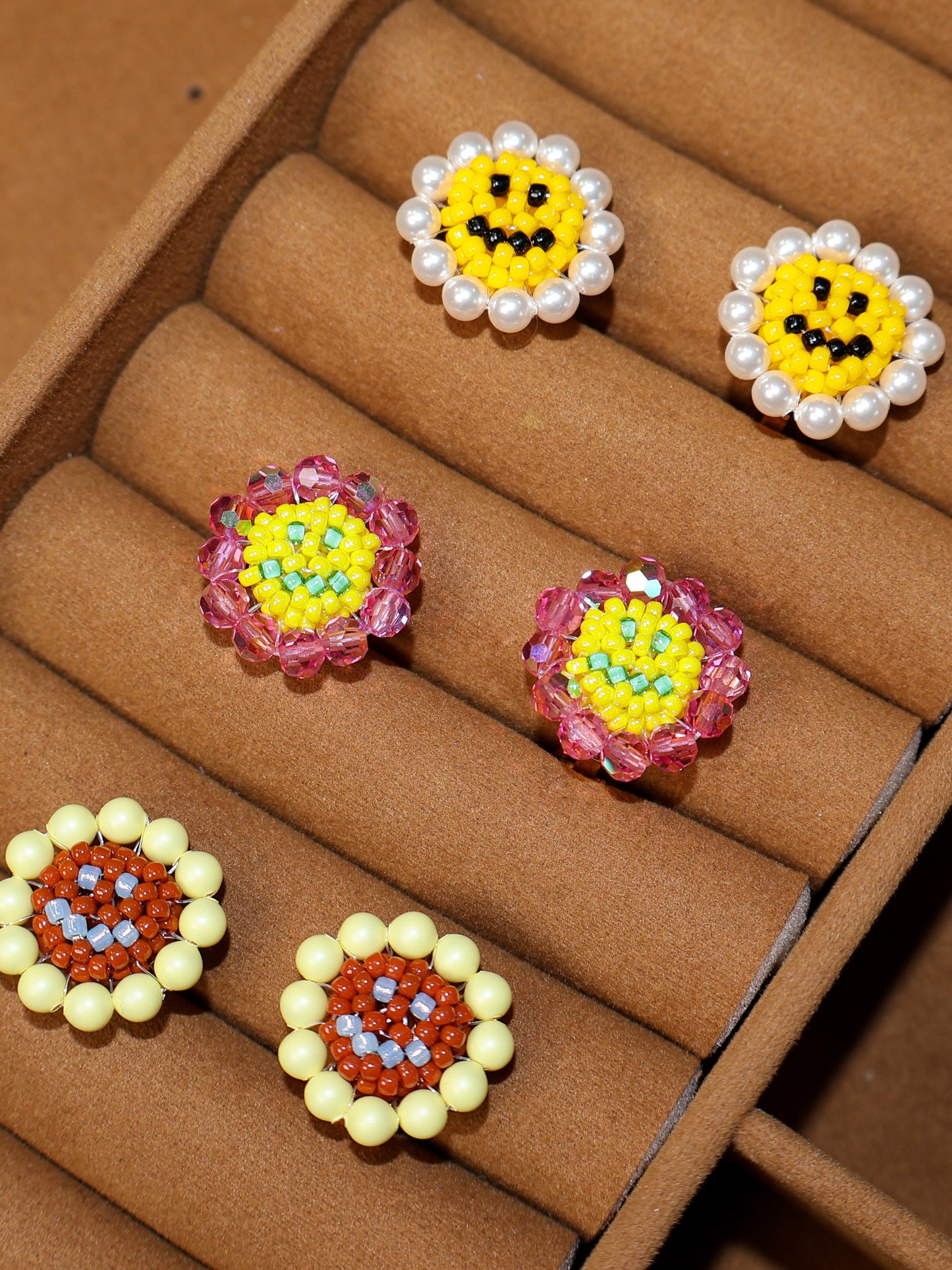 SNBC Smiley Daisy Ear Clips (a pair)