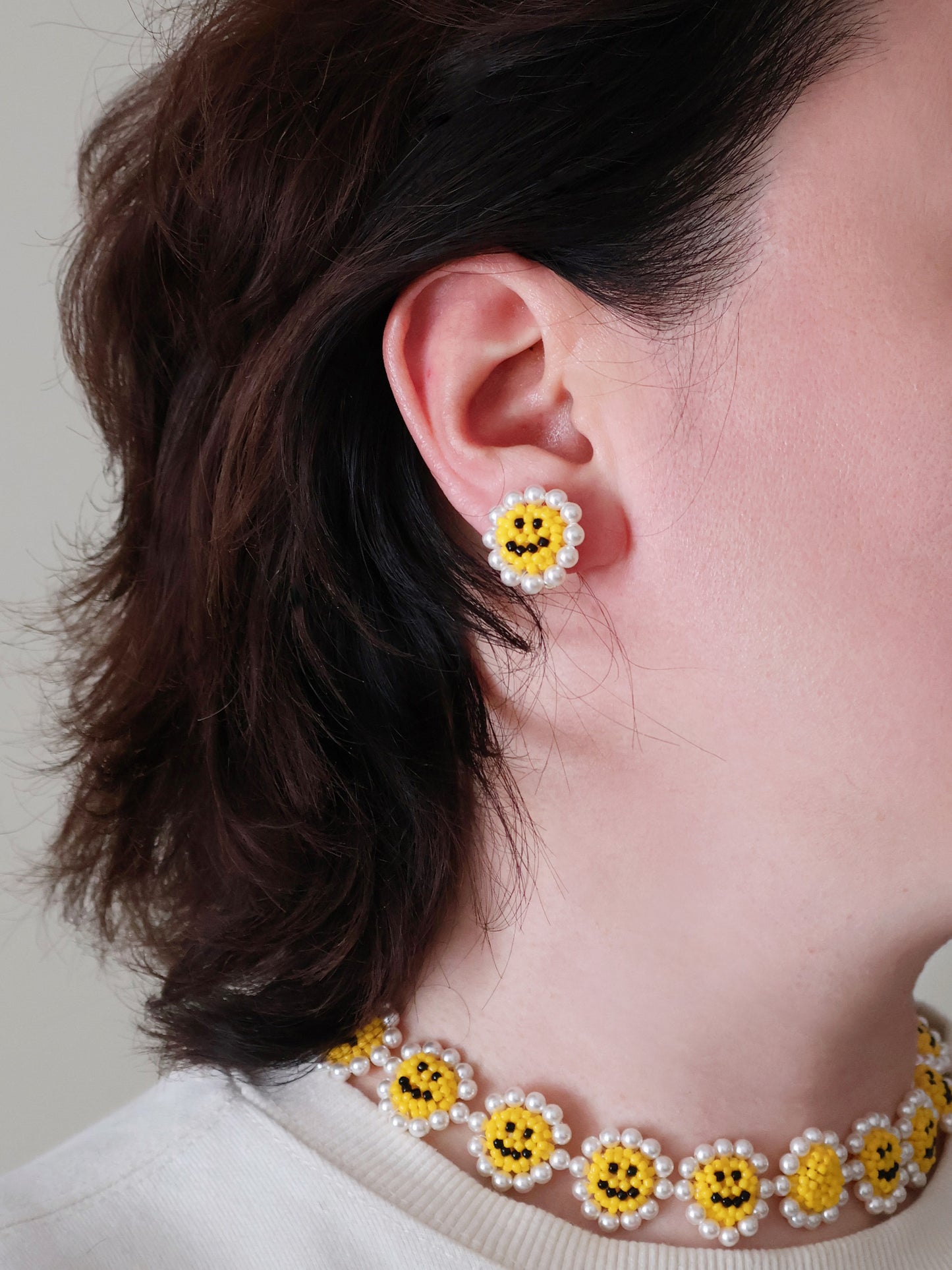 SNBC Smiley Daisy Ear Clips (a pair)